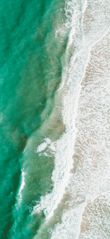 Waves crashing onto the beach