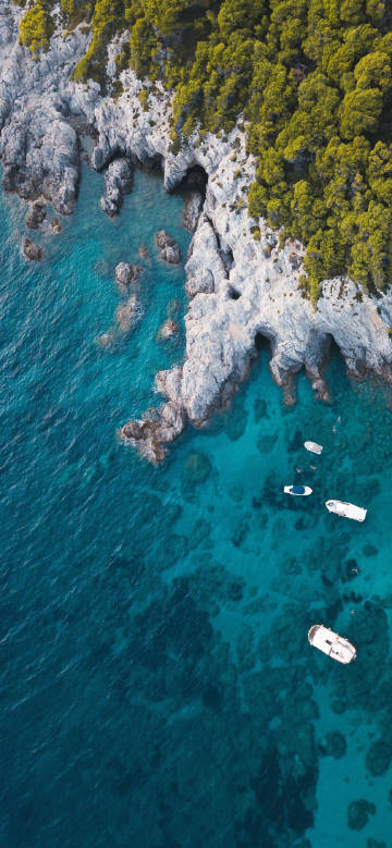 scenery of blue sea and rocky shore