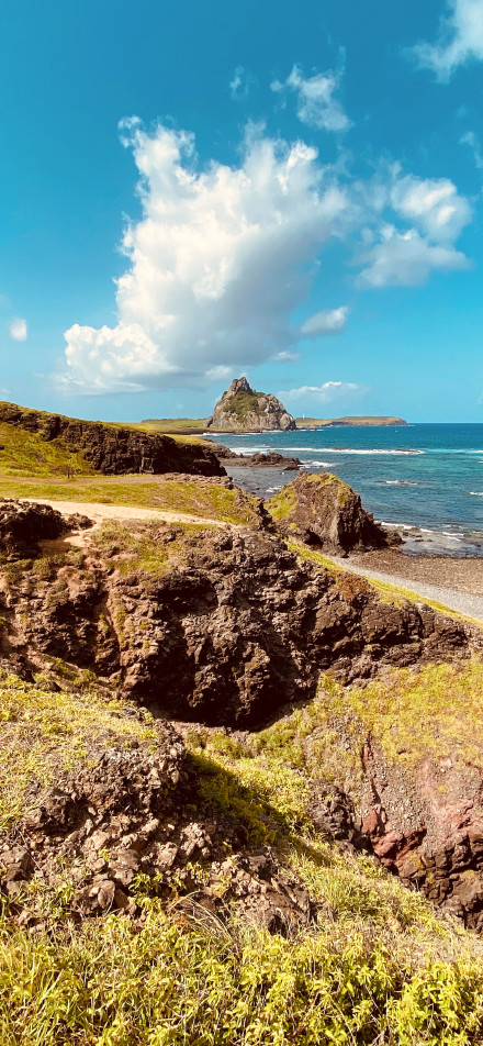 The rugged coast between blue sea and sky