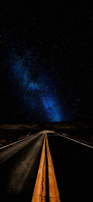 road under blue nebula