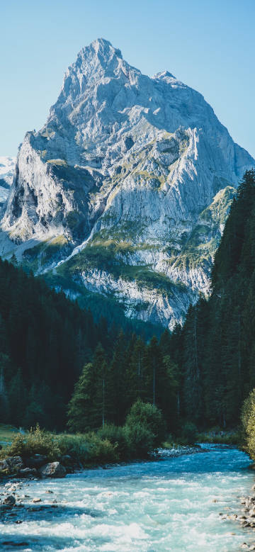 River under towering mountain peaks