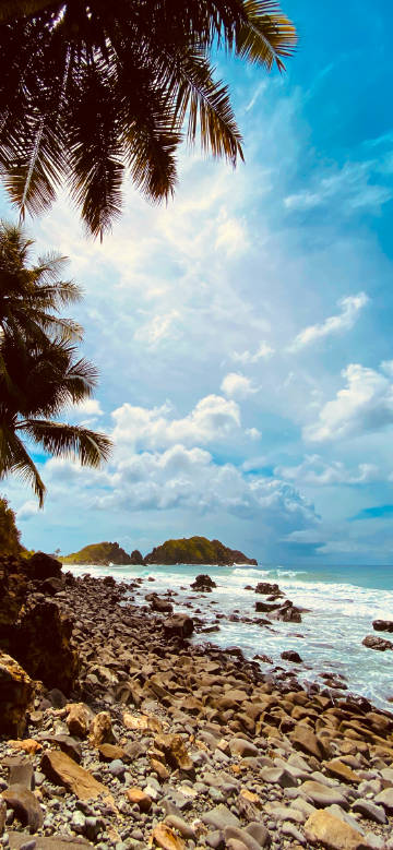 Rocky coast between blue sea and sky