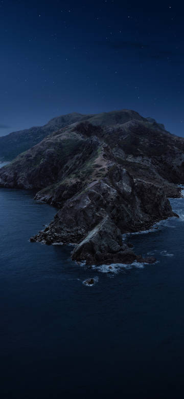 Mysterious coastal mountains under the starry sky
