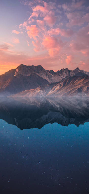 Mountains and lake under gorgeous sunset glow