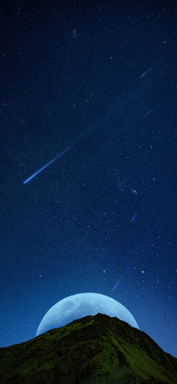 Moon and shooting stars on the mountain top