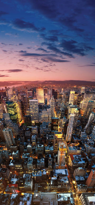 Night view of a bustling city with tall buildings