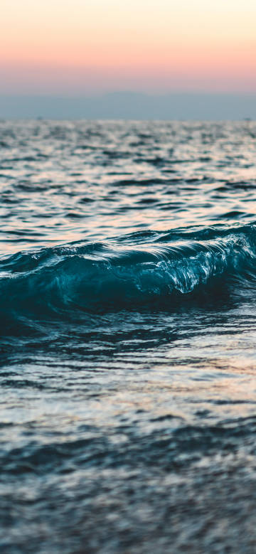 Sea waves in the sunset