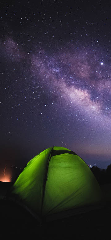 Camping tent under starry sky