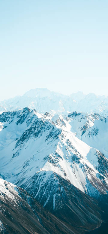 Snow mountains against blue sky