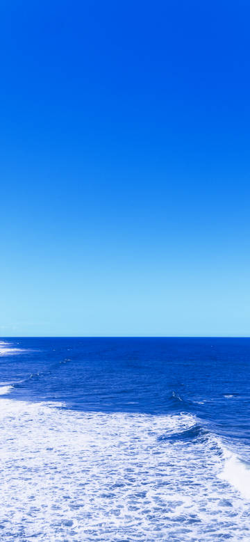 Clear blue sky and vast ocean