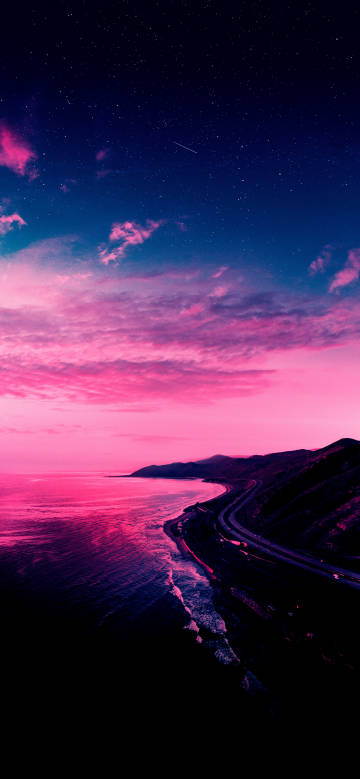 Coastal highway under the pink and purple stars