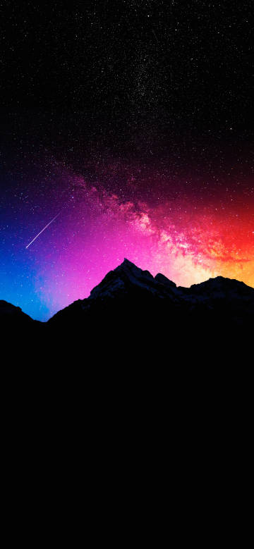 Gorgeous starry sky and mountain scene with a shooting star