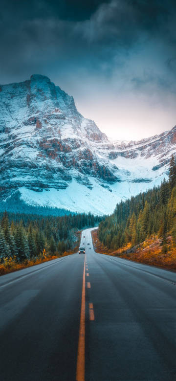 Road trip towards the snow-capped mountains