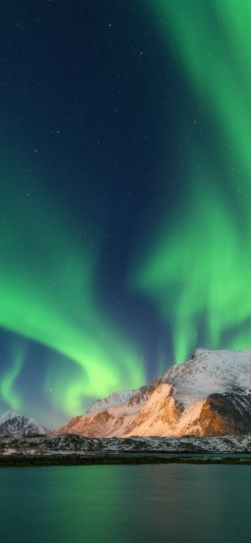 Fantastic Aurora scenery on the snowy mountains
