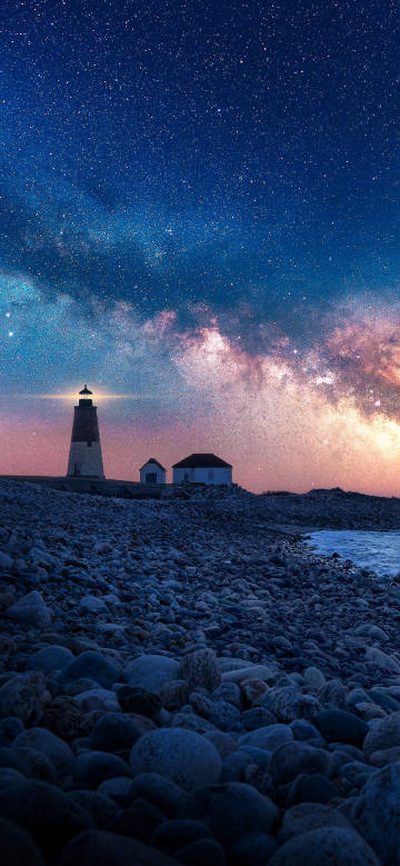 Night view of the beach lighthouse under the stars