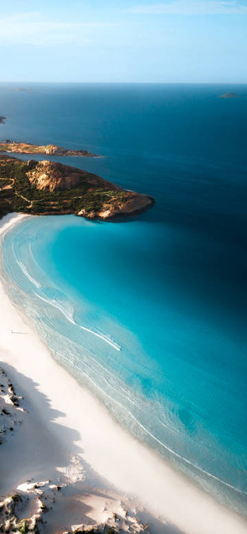 White sandy beach and clear blue water