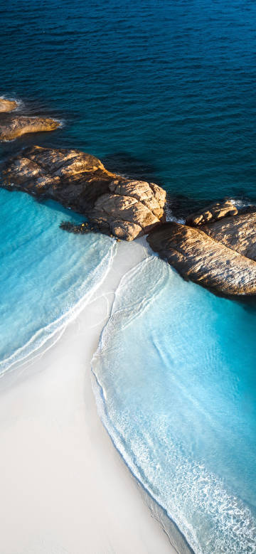 Coastal landscape under clear blue water