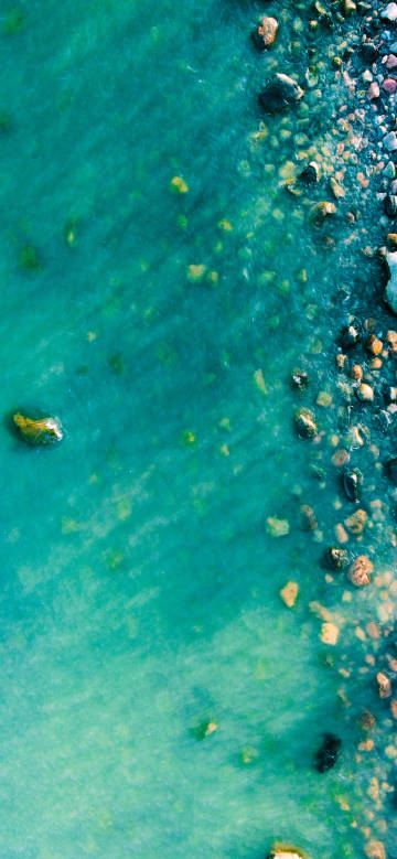 Overlooking the clear blue-green waters of the sea