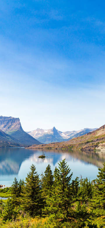 Tranquil lake amidst mountains and forests