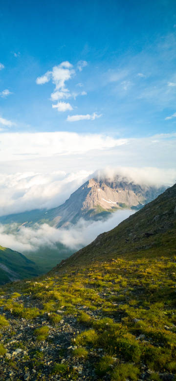 Majestic mountain peaks surrounded by clouds and mist