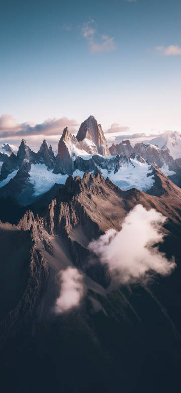 Majestic mountains amidst clouds and mist