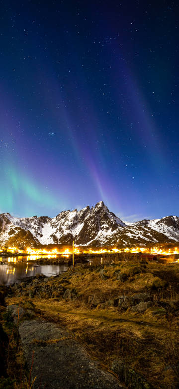 Magnificent scenery of snow mountains and aurora