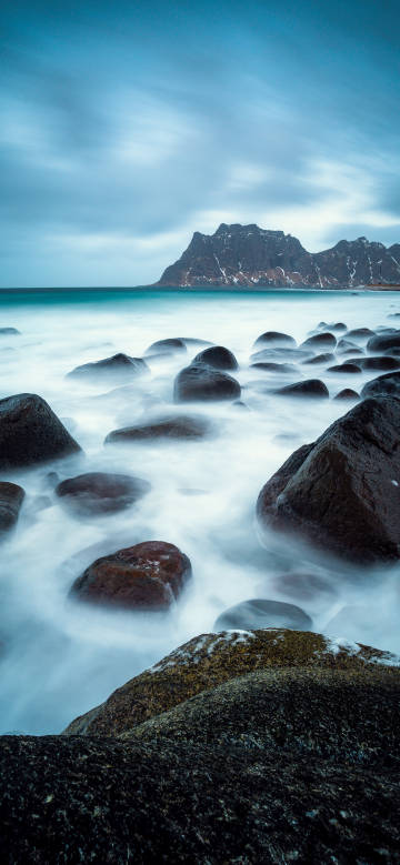 Rocks and surging waves by the sea