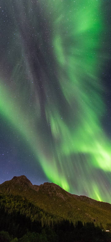 Green aurora over the mountains