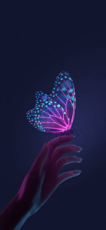 Dreamy glowing butterfly on fingertip