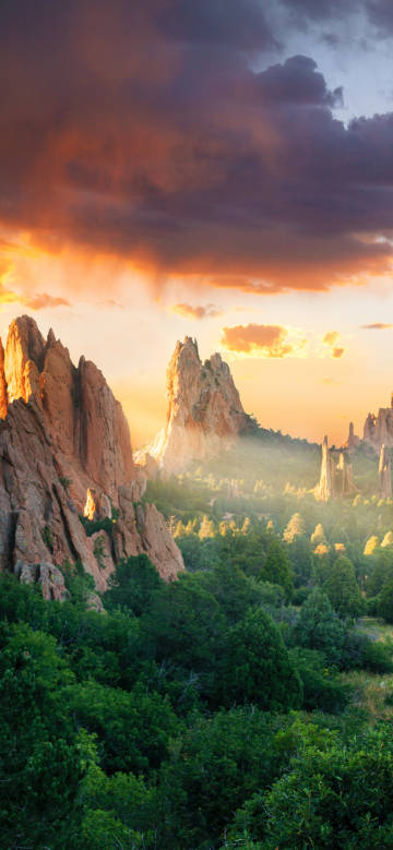 Sunlit rocky landscape in the mountains and forest