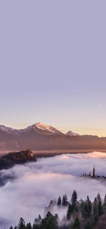 Check out the castle and church in mountain clouds