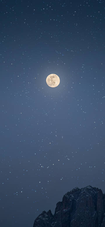 Moon and mountain scene under the night sky