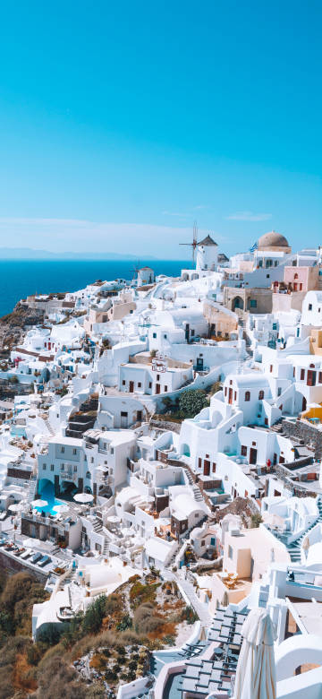 White town of Santorini under the blue sky
