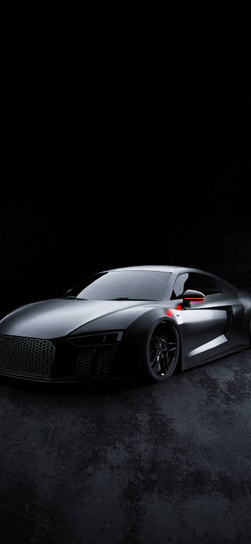 Sleek silver sports car against black background