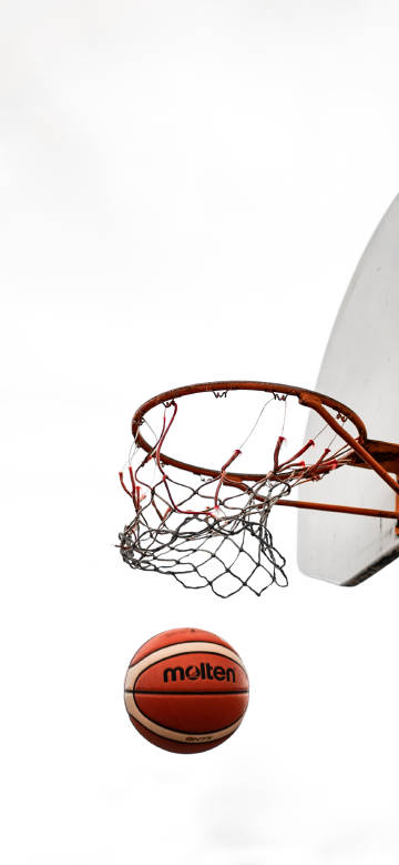 Basketball passing through the hoop moment