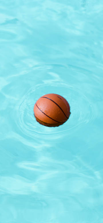 Basketball floating on the water phone wallpaper