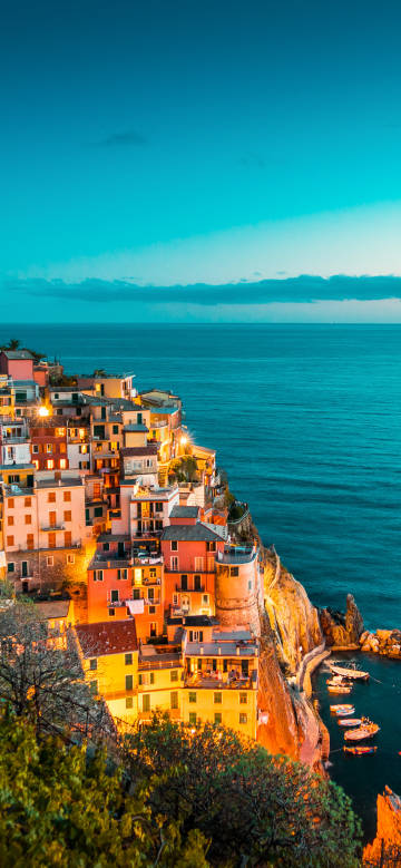 Charming night view of the seaside cliff town