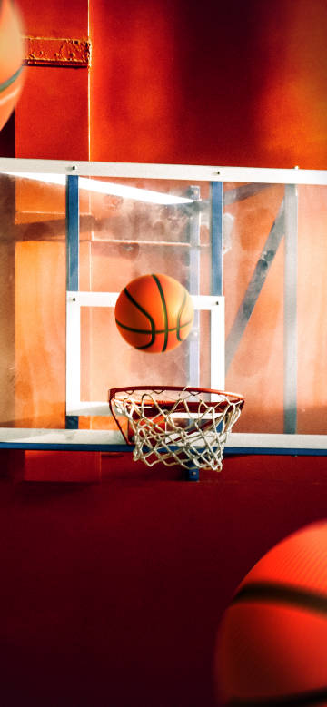 The moment the basketball is about to enter the blue frame