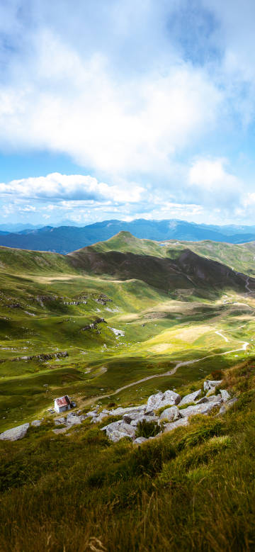 Scenery of a hut in the green mountain ranges