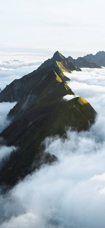 Majestic mountain ranges surrounded by clouds
