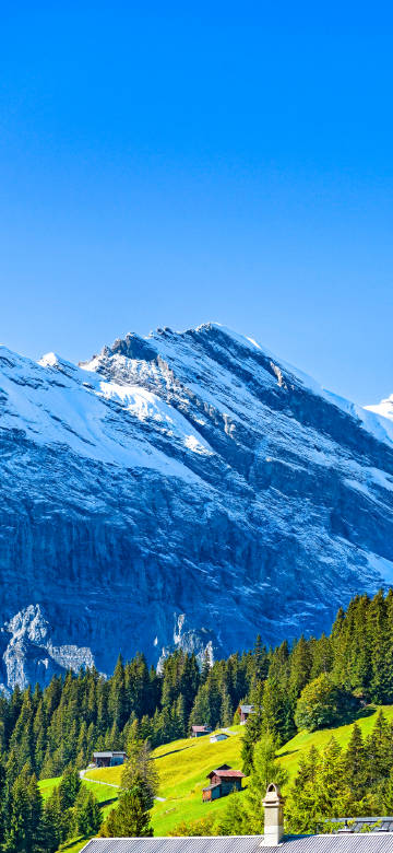 Alps under blue sky and white clouds