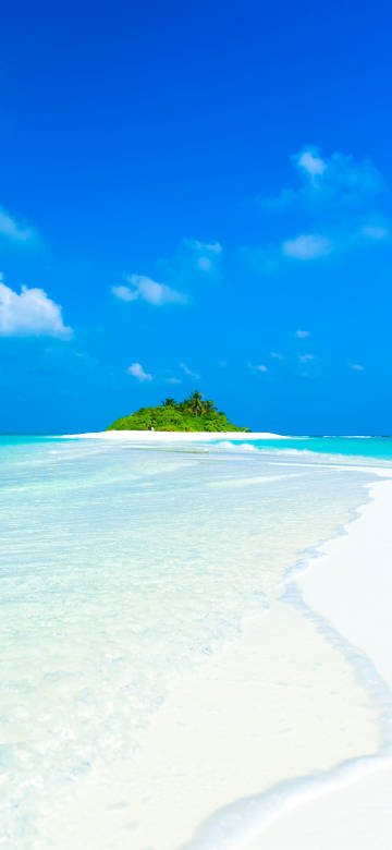 Beautiful beach and the distant green island