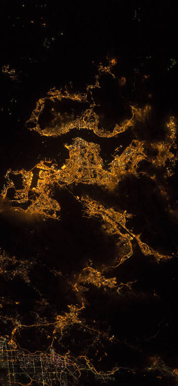 Overlooking the city’s light network from the night sky