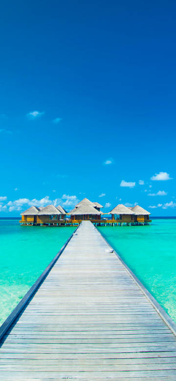 Maldives resort under blue sky and blue sea