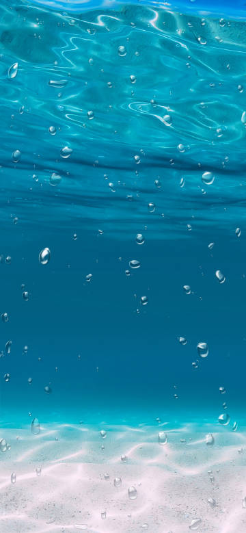 Clear blue water with many bubbles scattered in it