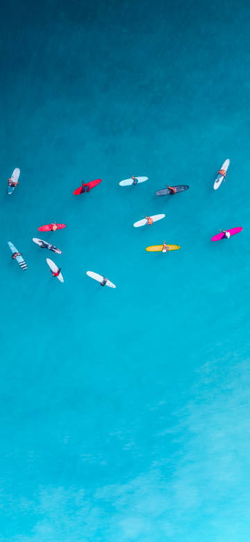 Overlooking the colorful boats on the sea phone wallpaper
