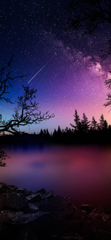 Dreamy moment with a meteor streaking across