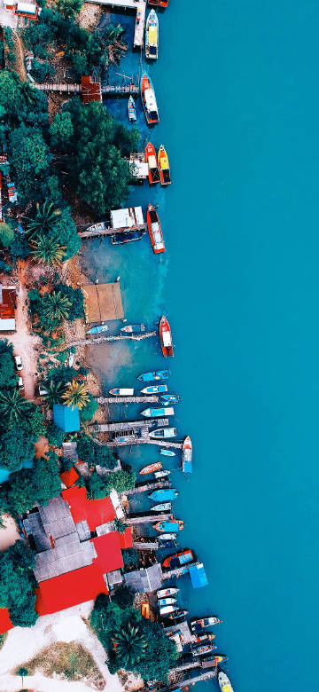 Aerial view of boats at the seaside pier