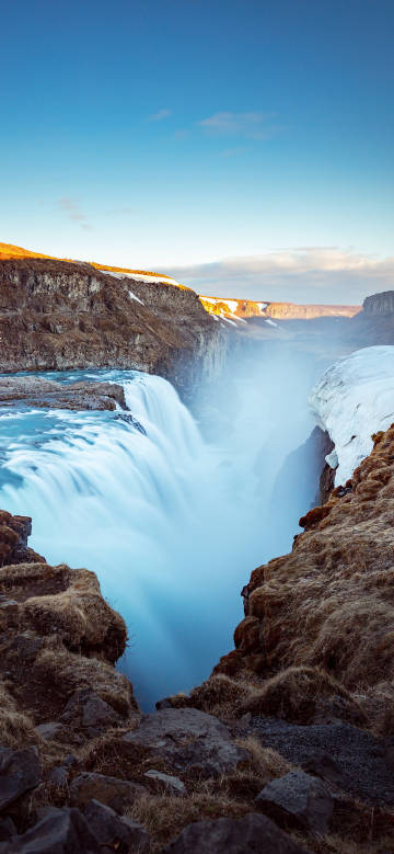 Magnificent waterfall under the blue sky