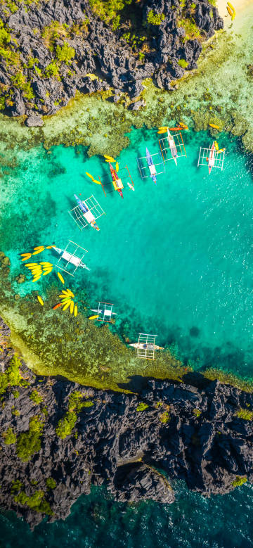 Overlooking the boats on the clear green sea